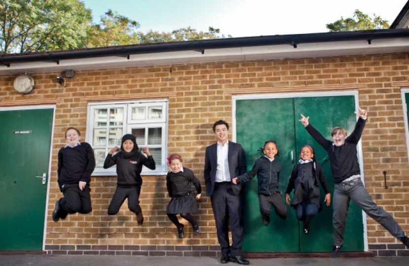 Alan Mak with breakfast club children in east London