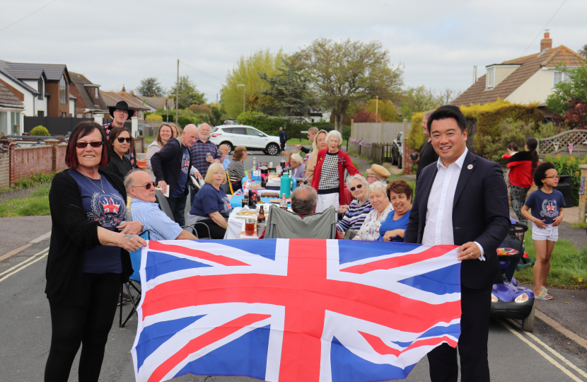 Local MP Alan Mak presents Angela Hopkins with a Union flag