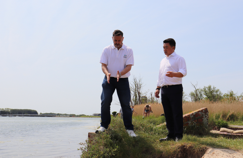 Photo: Alan Mak MP inspects the Langstone Mill Pond and surrounding area with Lyall Cairns, Head of Coastal Partners.