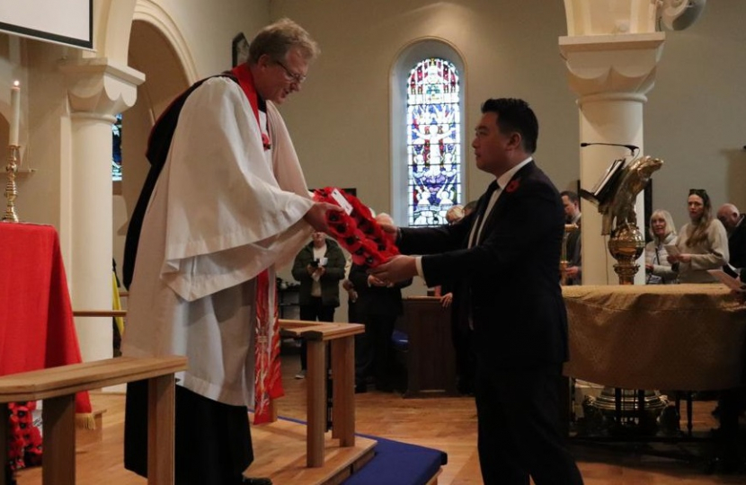 Local MP Alan Mak lays a wreath at St James’ Church. 