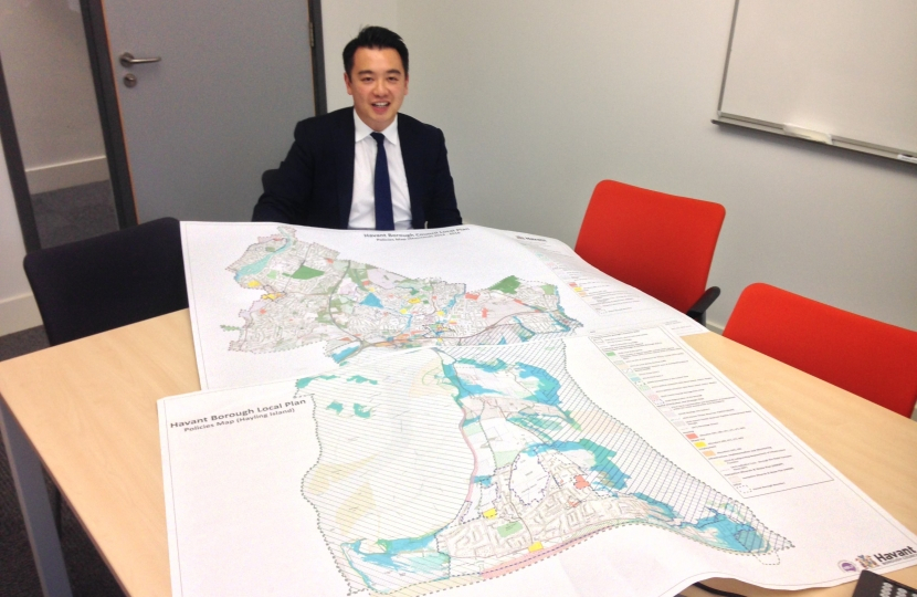 Alan Mak MP with a previous version of Havant Borough Council's Local Plan 