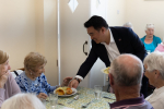 Local MP Alan Mak serves roasts to elderly residents at Age Concern Hayling Island's Lunch Club