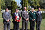 Alan Mak MP and local veterans paying their respects at the Bayeux War Cemetery in 2019 