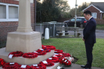 Local MP Alan Mak pays his respects at the Cenotaph on Elm Grove in Mengham.