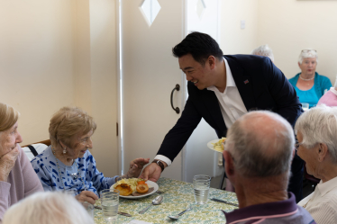 Local MP Alan Mak serves roasts to elderly residents at Age Concern Hayling Island's Lunch Club