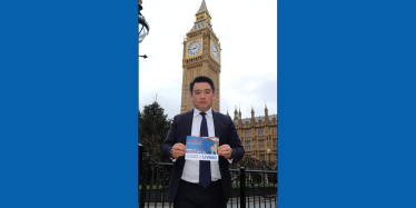 Alan Mak MP with his Cost of Living Guide after successfully campaigning in Westminster for the payments to be delivered. 