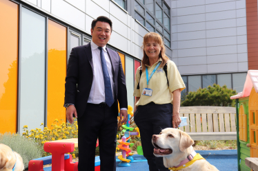 Local MP Alan Mak met Hayling Island volunteer Tess Balchin, and therapy dog Maggie.